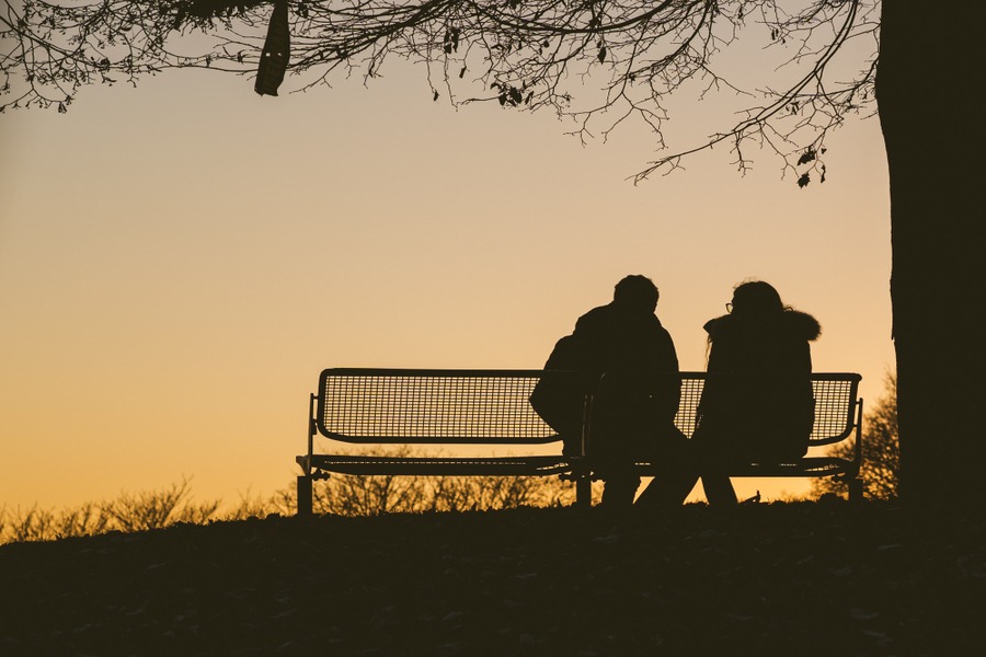 Couple reflecting signs of love or loneliness.
