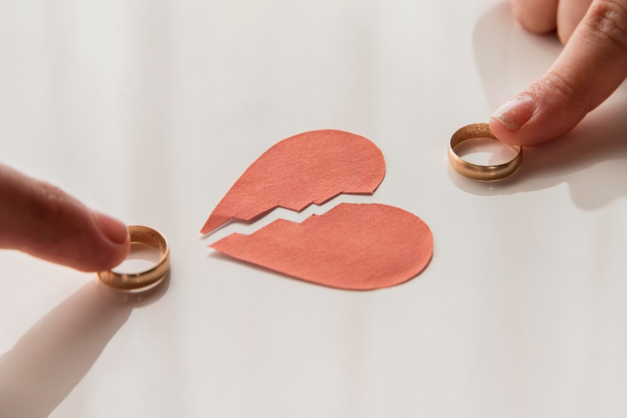 Person reflecting on their love life while comparing it to others online.